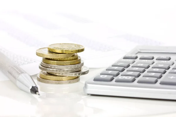 Euro coins and calculator Stock Image