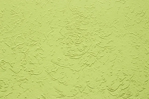 Lime plaster, wall decoration, backdrop texture. Rough wall surface with color light green stucco coating.