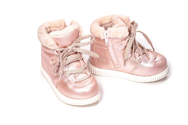 Children shoes, pink boots with faux fur for the winter on a white background. Lacing eco-friendly children's winter shoes — Stock Photo, Image