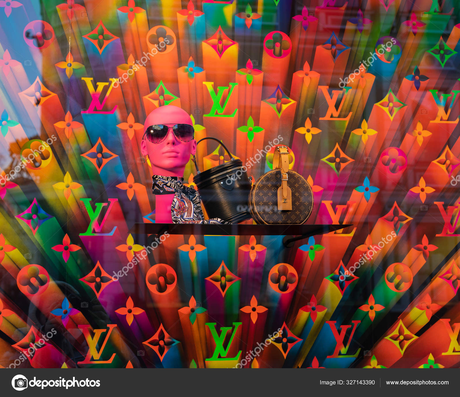 Moscow, Russia - December 1, 2019: Louis Vuitton storefront, multicolored  rainbow background backdrop design, glasses scarf and two bags with a logo.  Bright hologram fluorescent color – Stock Editorial Photo © OlaKorica  #327143390