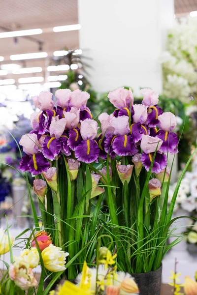 A bouquet of sophisticated fake irises on long stems. purple white fabric iris petals, home decor interior design fake flower for decoration — Stock Photo, Image