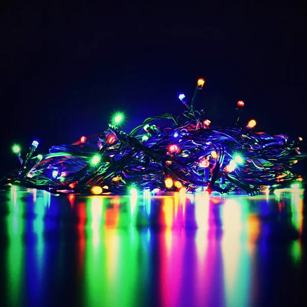 Christmas Lights Black Background Copy Space Colored Reflecting Surface — Stock Photo, Image