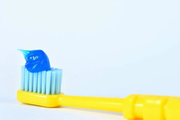 Toothbrush with paste on a white background. — Stock Photo, Image