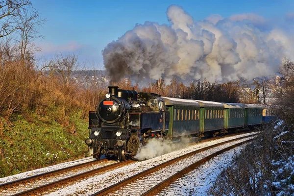Beautiful old steam train with wagons running on rails at sunset. Excursions for children and parents on festive special days. Czech Republic Europe. — Stock Photo, Image