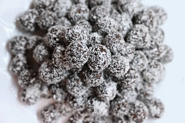 Rum balls in coconut. Classic Czech Christmas cookies. Hand made unbaked sweets with alcohol. — Stock Photo, Image