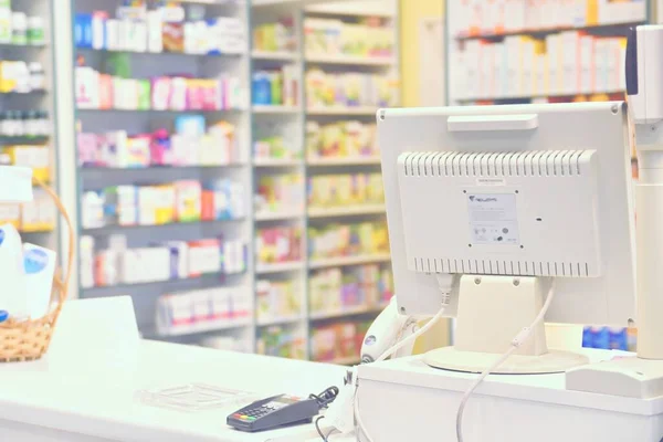 Cash desk - computer and monitor in a pharmacy. Interior of drug and vitamins shop. Concept for medicine and health - Coronavirus - COVID 19