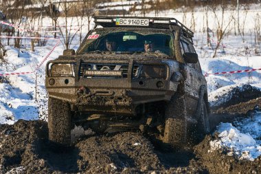 Off-road vehicle brand Nissan overcomes the track clipart