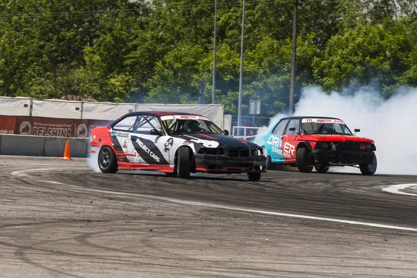 Unknown riders on the car brand BMW overcomes the track — Stock Photo, Image