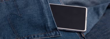 panorama beyaz cep telefonu mavi kot üzerinde
