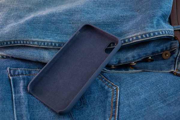 multi-colored mobile phone case on a denim background