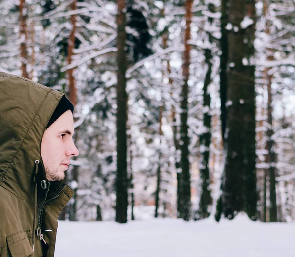 stock image Young man in winter forest