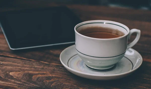 Tea in porcelain cup — Stock Photo, Image