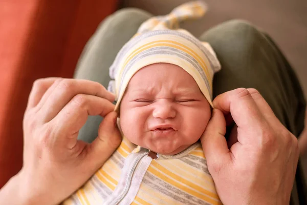 Dad Dressing Infant Child Making Wry Face Unhappy Grimace Hands — Stock Photo, Image
