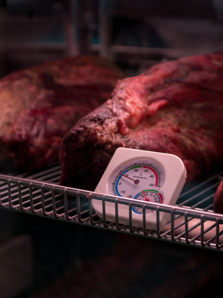 Prepare dried meats. Beef jerky. Jerky. Meat shop. Marbled beef dry aging lies in the refrigerator Whisky Dry-Aged Steaks. Beef & Glory, Display of Dry Aged Meat Steaks in butchers shop or restaurant 