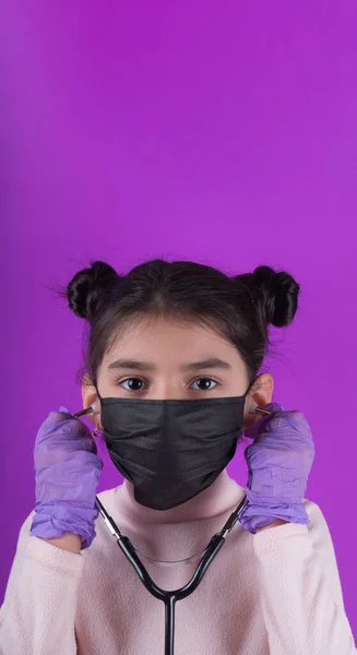 Little Cute Girl Black Mask Stethoscope Purple Background Stop Covid — Stock Photo, Image