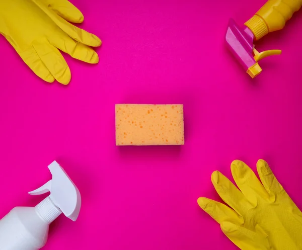 Sponge for washing dishes in hand. Hand in a latex glove isolated. A hand in a glove holds a sponge for washing and cleaning. Cleaning or housekeeping concept background. Frame for text or advertising