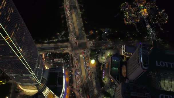 夜のロッテワールド タワーと蚕室のロッテワールドの空中ビデオ ソウル — ストック動画