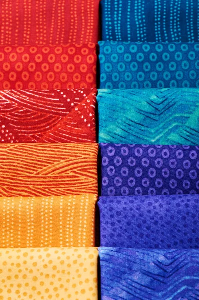 Pieces of quilting fabrics lying on top of each other — Stock Photo, Image
