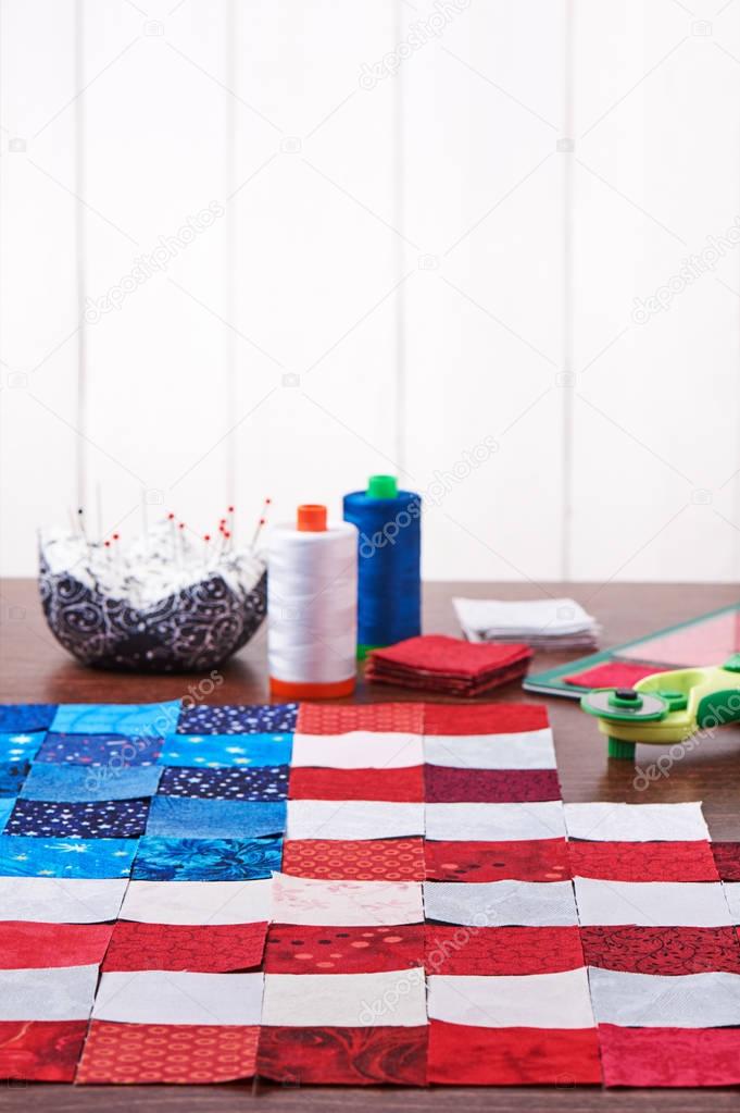 Preparing to sewing of pieces of fabrics that look like a flag o