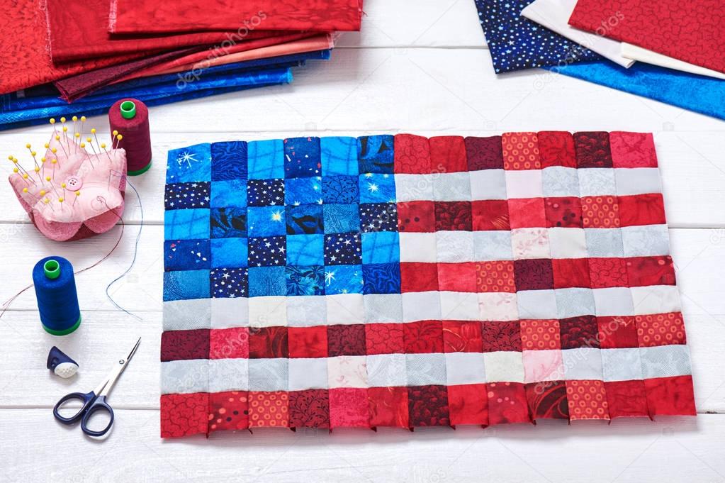 Square pieces of fabrics selected and stitched like a flag of US