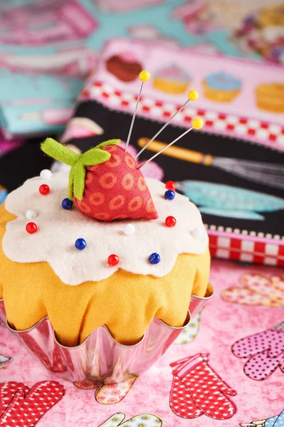 The patchwork pin cushion like a cupcake with strawberry — Stock Photo, Image