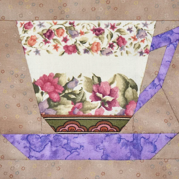 Blocco patchwork della tazza con un modello di fiori — Foto Stock