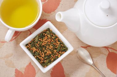 Japanese genmaicha, a mix green tea with roasted rice, cup of te clipart