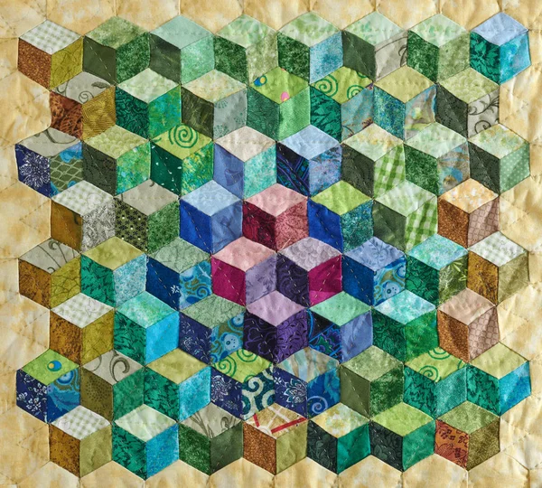 Fragment of quilt sewn from diamonds and has view three-dimensional — Stock Photo, Image