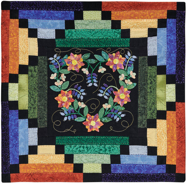 Patchwork style pillowcase with applique in the center