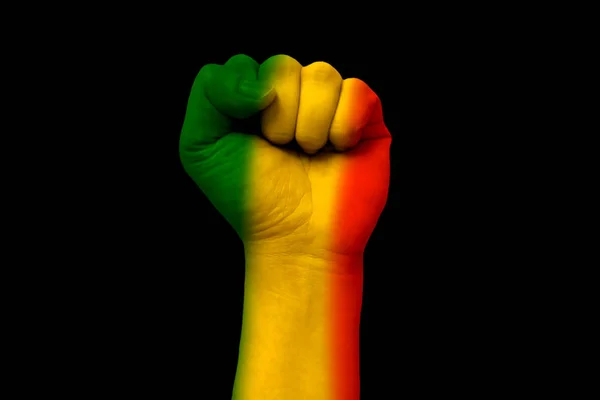 Green yellow red on human hand, reggae background concept — стоковое фото