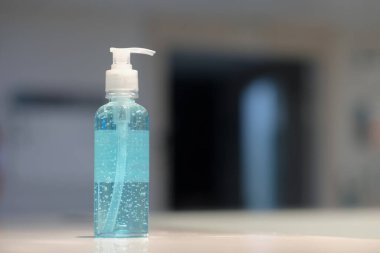 A man using alcohol gel for cleaning hands to protect coronavirus