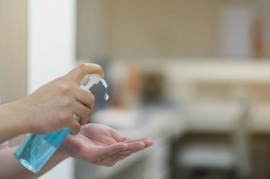A man using alcohol gel for cleaning hands