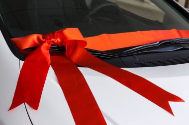 red ribbon on the car background