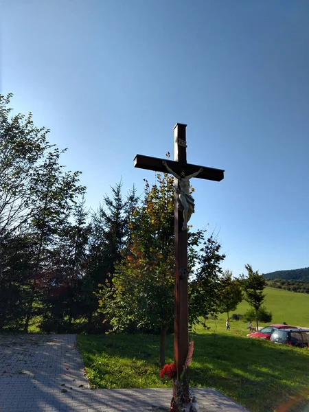 cross on the road on natural background