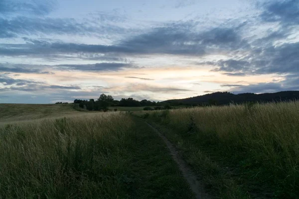 stock image sunset over the hills and town. Slovakia