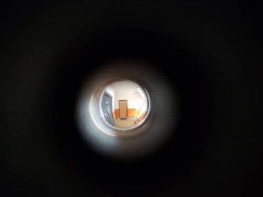 View to the hall through peephole eyelet in the door. Slovakia clipart