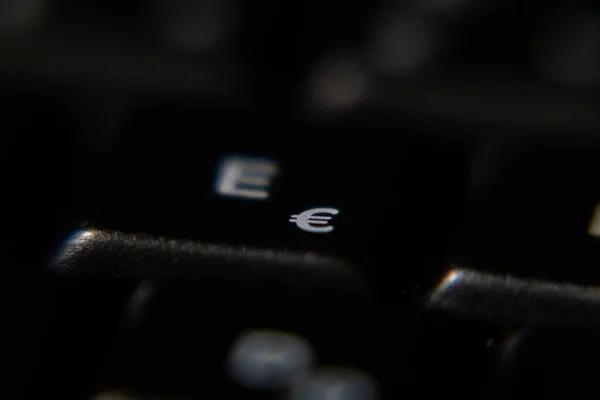 laptop keyboard e letter key, close up shot