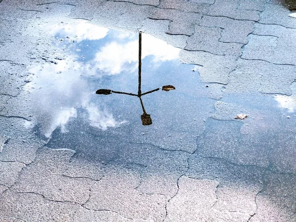 Puddle on road during rain. Slovakia