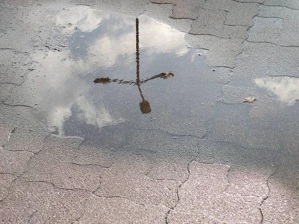 Puddle on road during rain. Slovakia