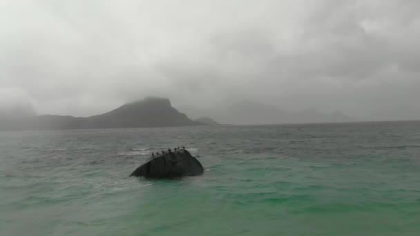 Scenic view on mountain with cloudy peaks and waves with stone in the sea — Stock Video