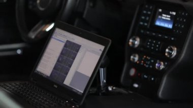 Automobile on stand for measuring car power.