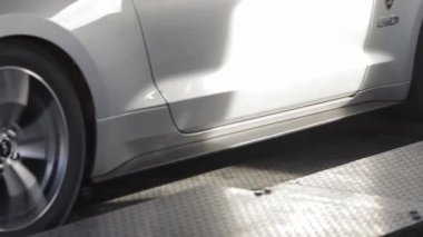 Automobile on stand for measuring car power.