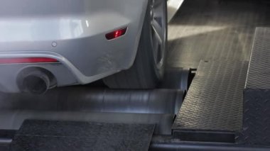 Automobile on stand for measuring car power.