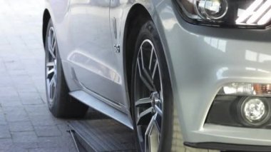 Automobile on stand for measuring car power.