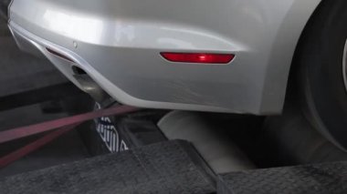 Automobile on stand for measuring car power.