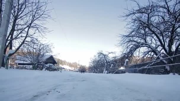 Point of view from drives side, vehicle driving on snowy mountain road. — Wideo stockowe