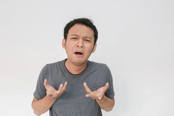 Funny Asian Man Grey Shirt Gesturing Studio — Stok Foto