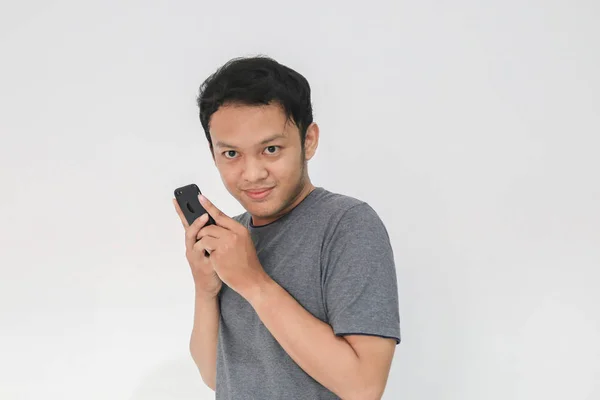 Funny Asian Man Grey Shirt Using Smartphone Gesturing While Posing — Stock Photo, Image