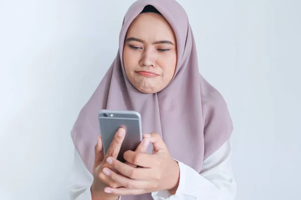 Girl with sad emotions having video conversation via mobile phone