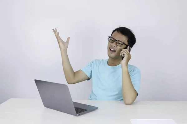 asian manager negotiating using laptop computer